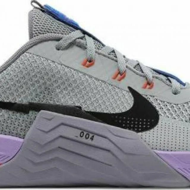 Nike men's training shoes in light smoke grey, purple, and black